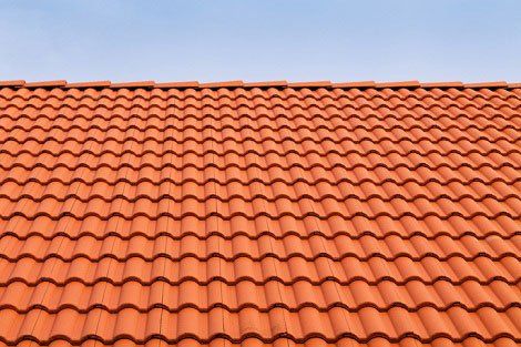 Considering Pros & Cons of Slate Roofing vs. Tile Roofing
