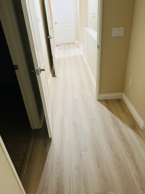 hallway into bathroom in northcounty vinyl plank floor install repair