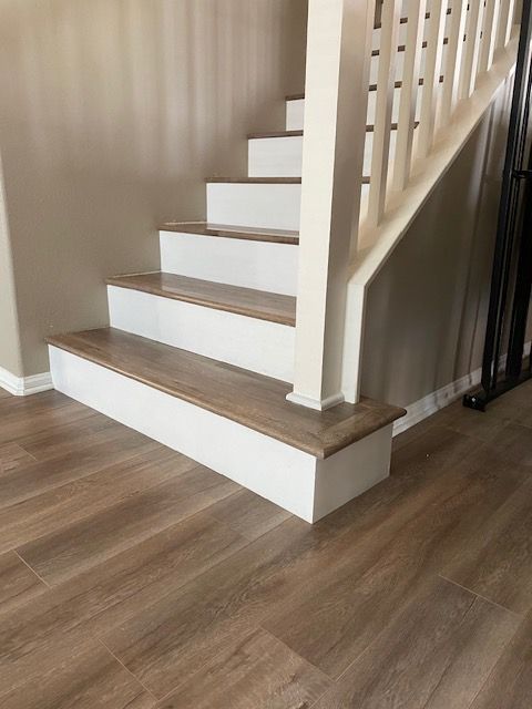 side angle north county SD stairs with white risers flooring waterproof laminate