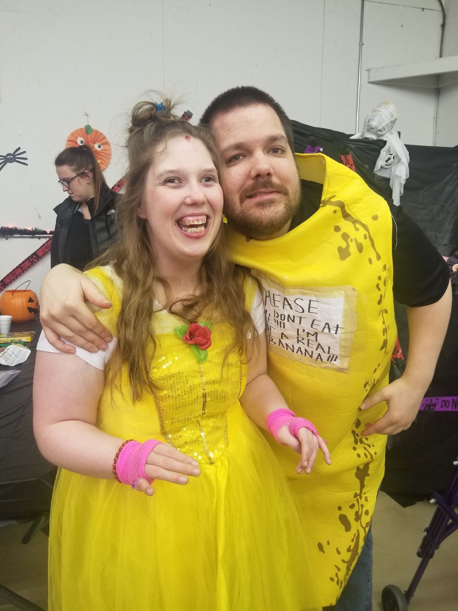 A man and a woman in costumes are posing for a picture.
