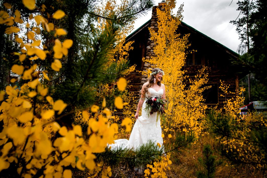 bride-walking-through-fall-leaves