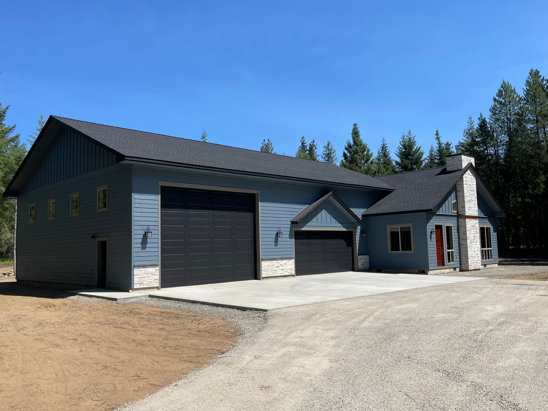 A large house with a garage and a chimney
