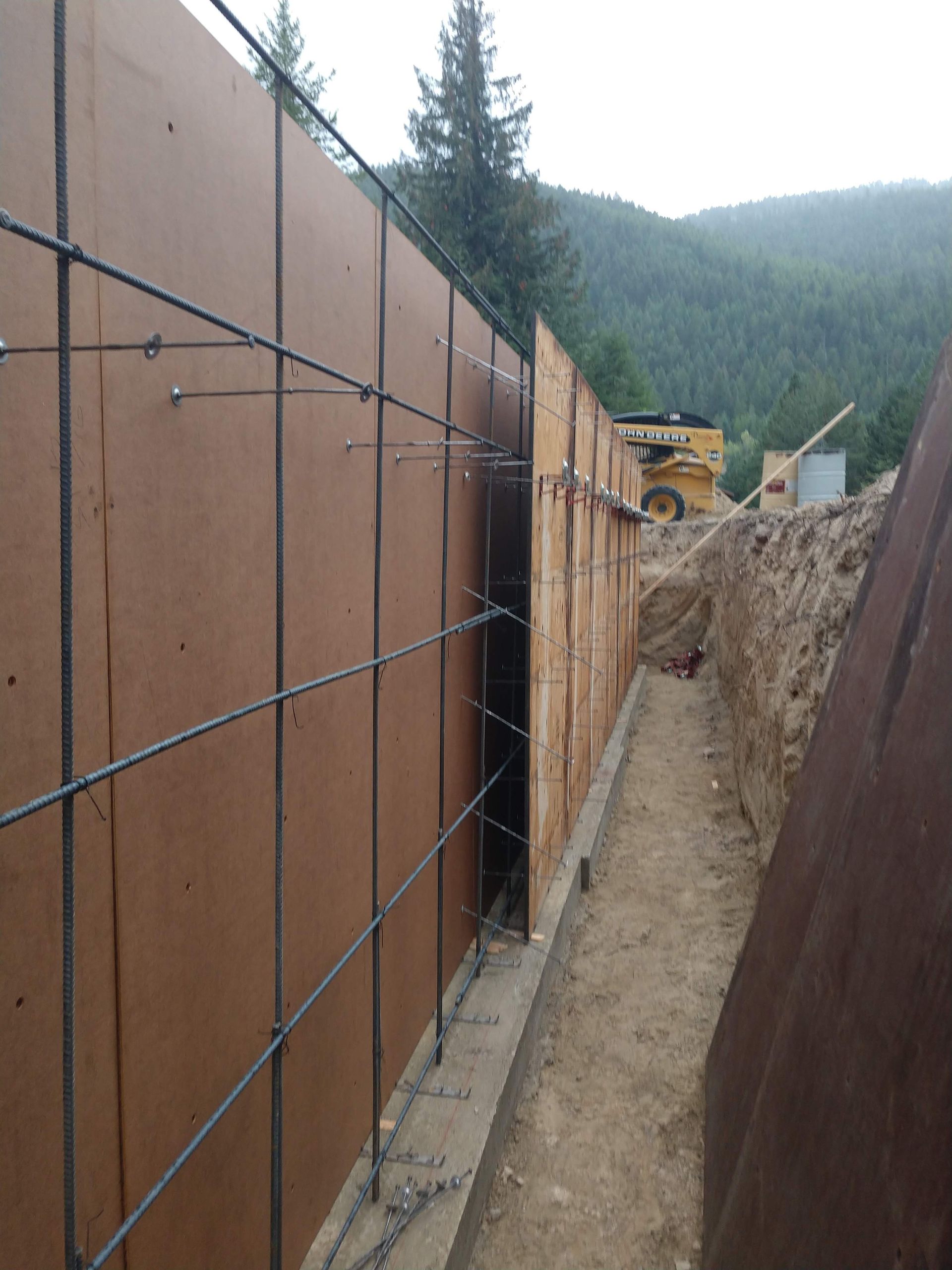 A construction site with a yellow bulldozer in the background