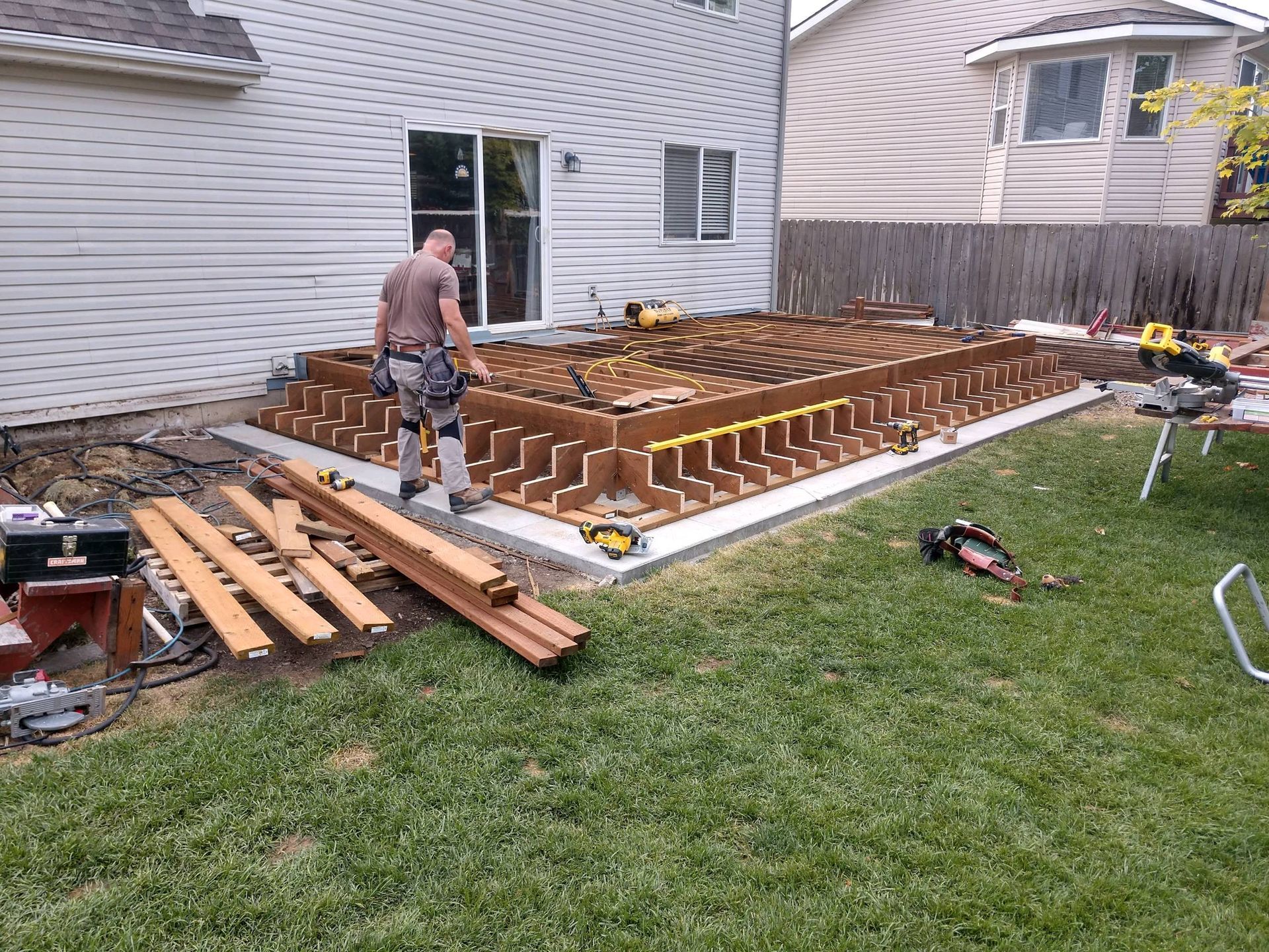 a new deck is being built in a backyard