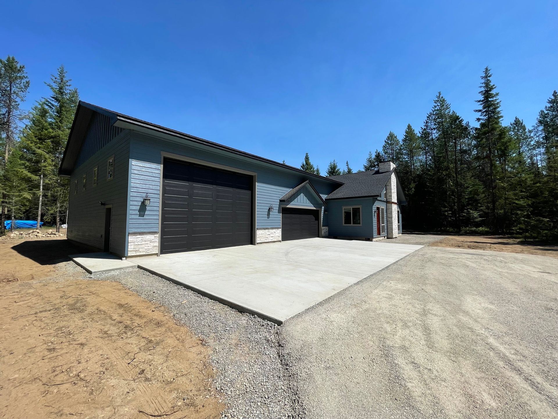 A house with a garage and a driveway in front of it