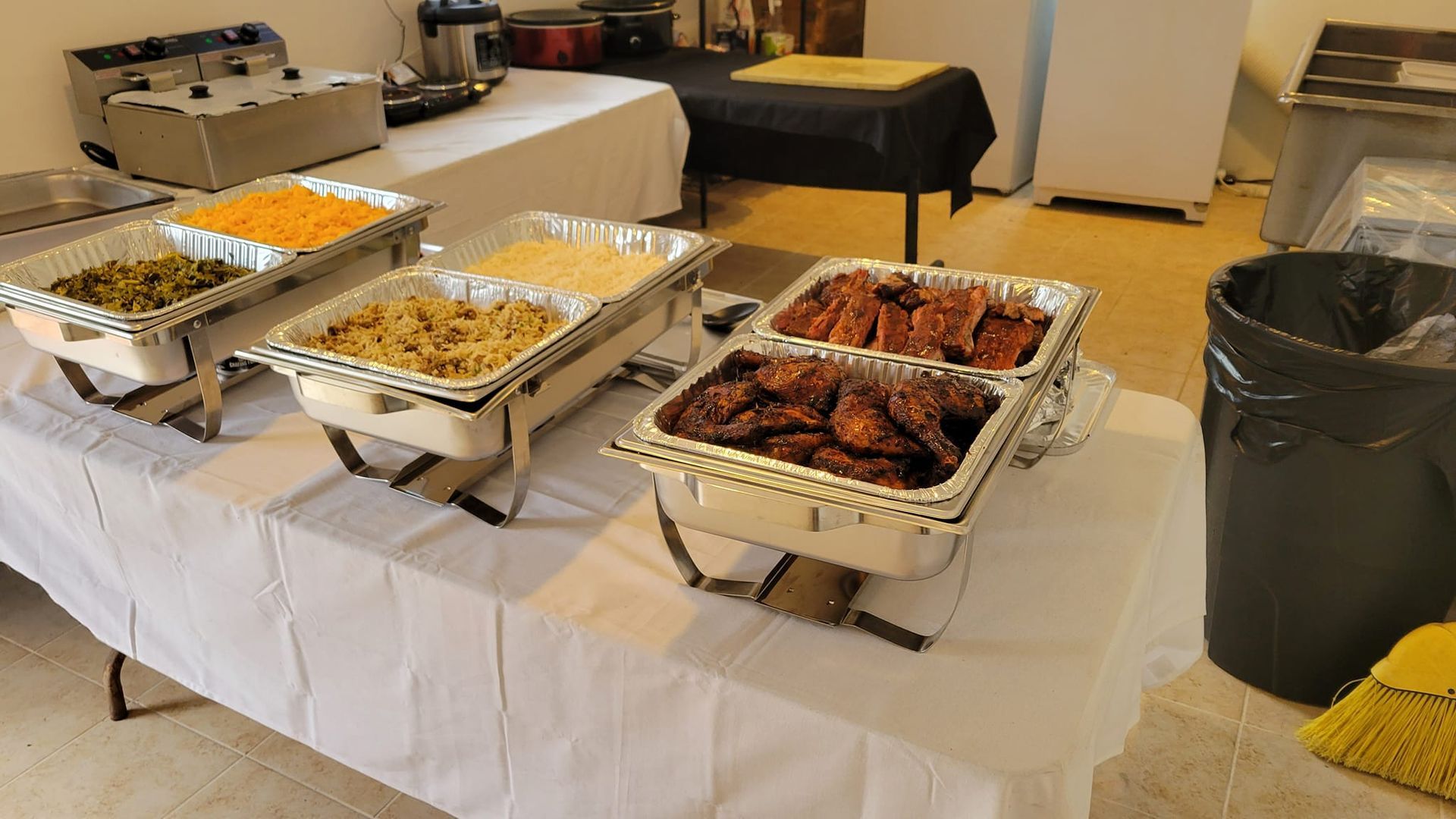 A buffet table with a variety of food on it.