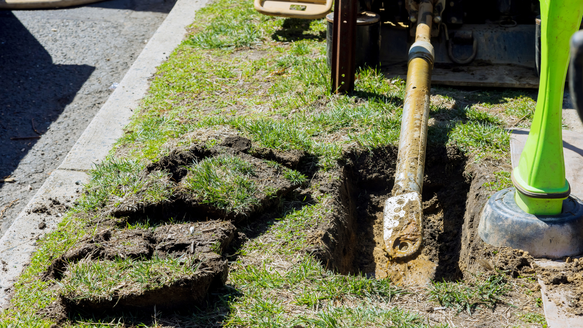 A shovel is being used to dig a hole in the ground.