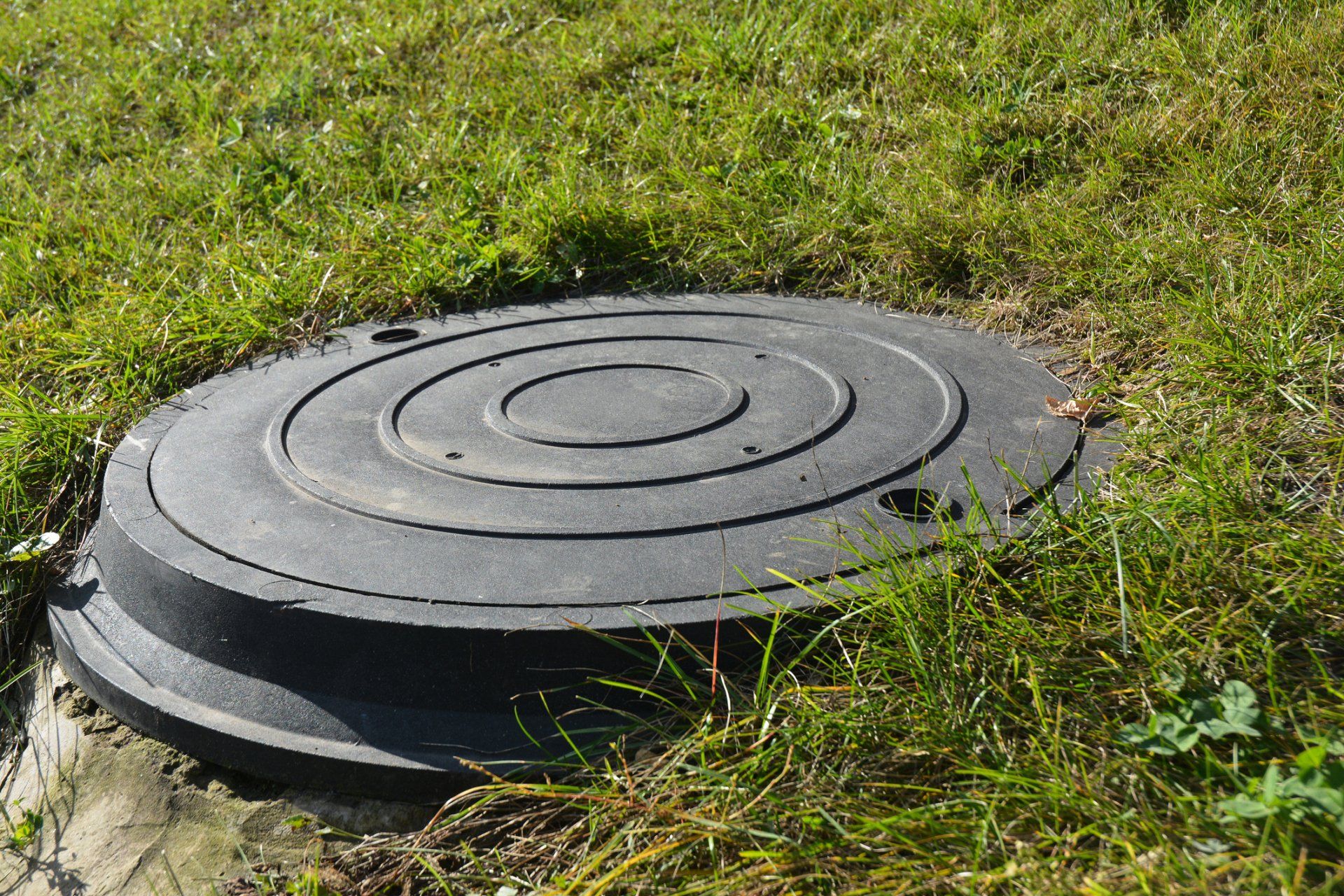 Manhole Plastic Cover in the Garden Lawn — Ruffin, SC — Lane’s Well & Septic