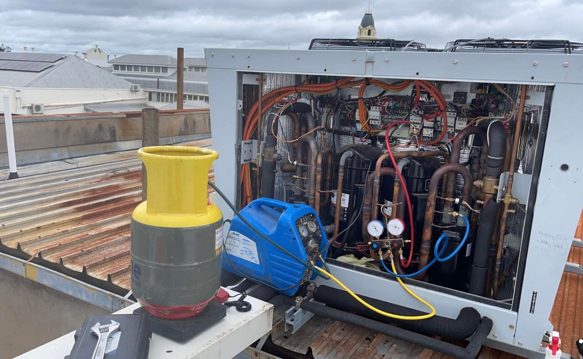 Open Rooftop Hvac Unit With Exposed Wiring — A & T Air-Conditioning and Refrigeration in Millbank, QLD