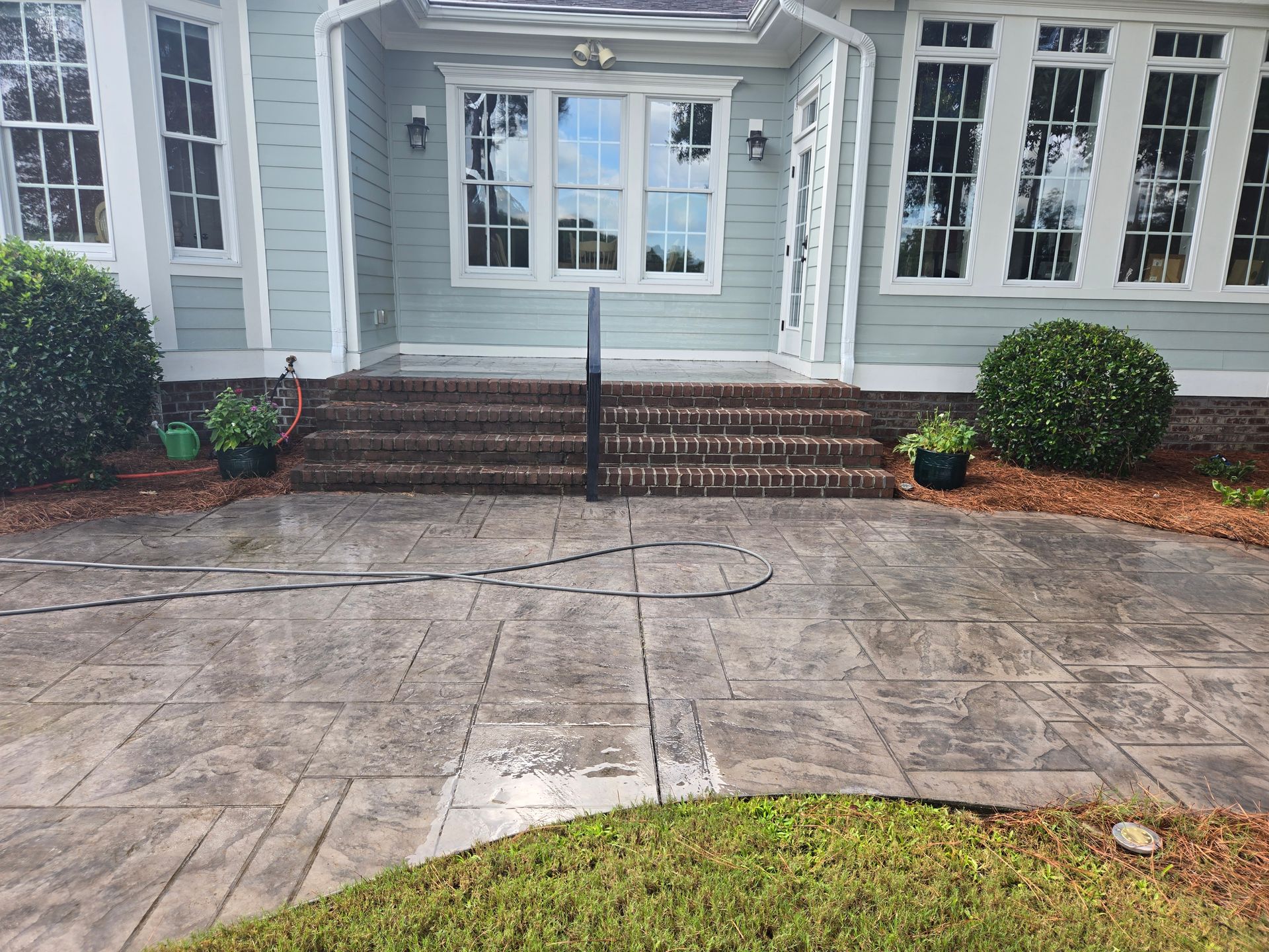 Siding, trim, porch steps, and patio cleaning