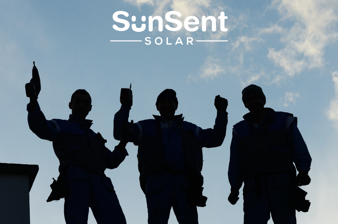 Three roofers standing in front of a sunsent solar logo