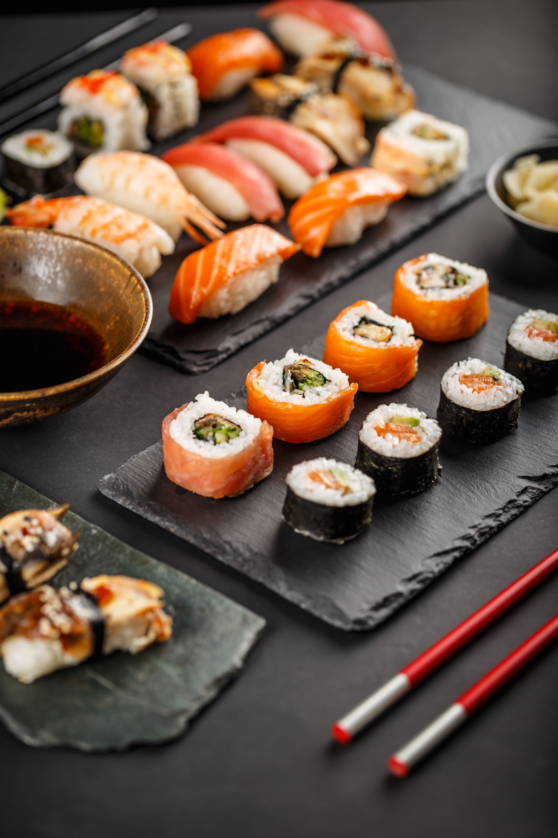 There are many different types of sushi on the table.
