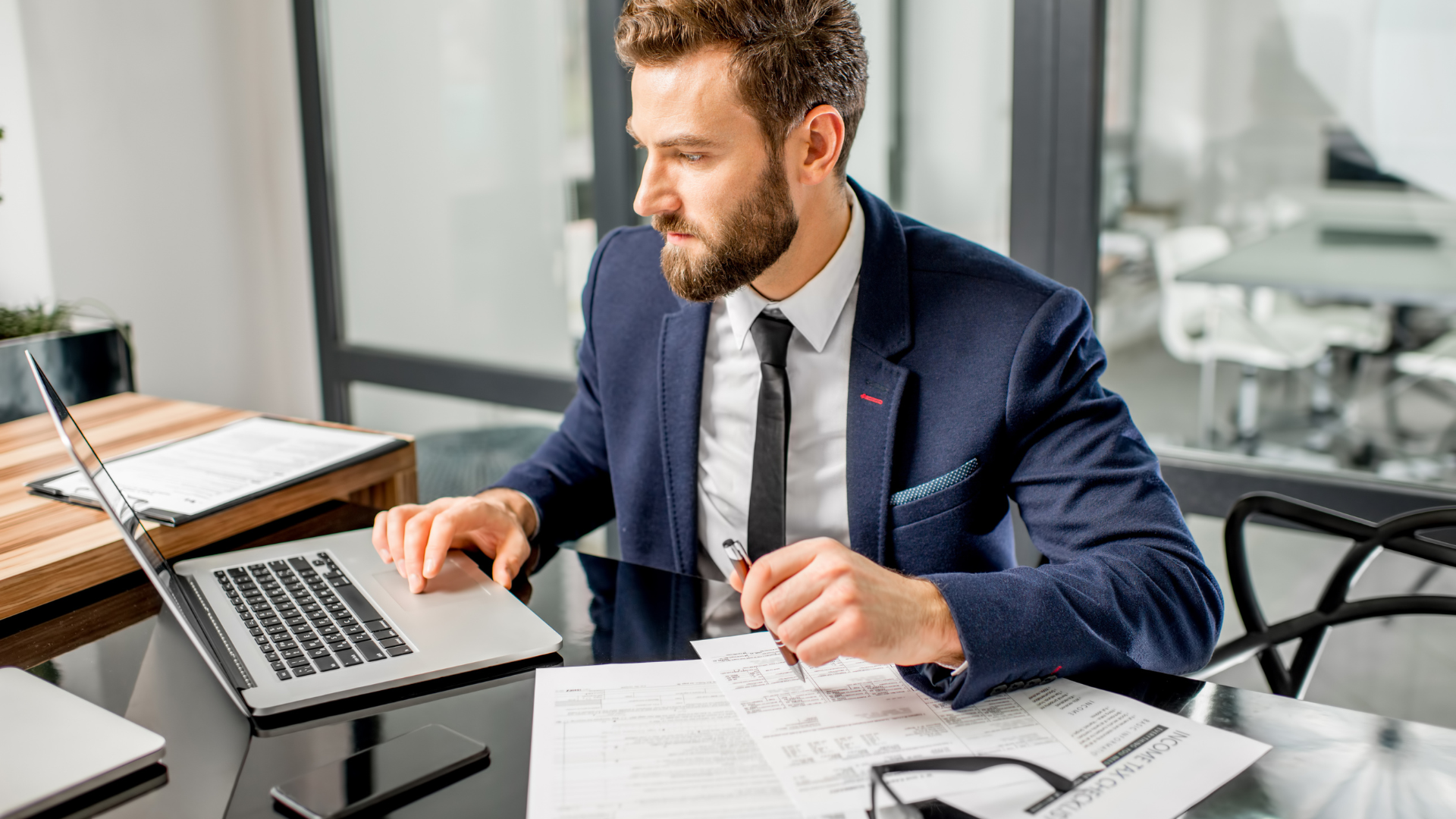  A financial professional analyzing corporate tax credits and business deductions on a digital balance sheet.
