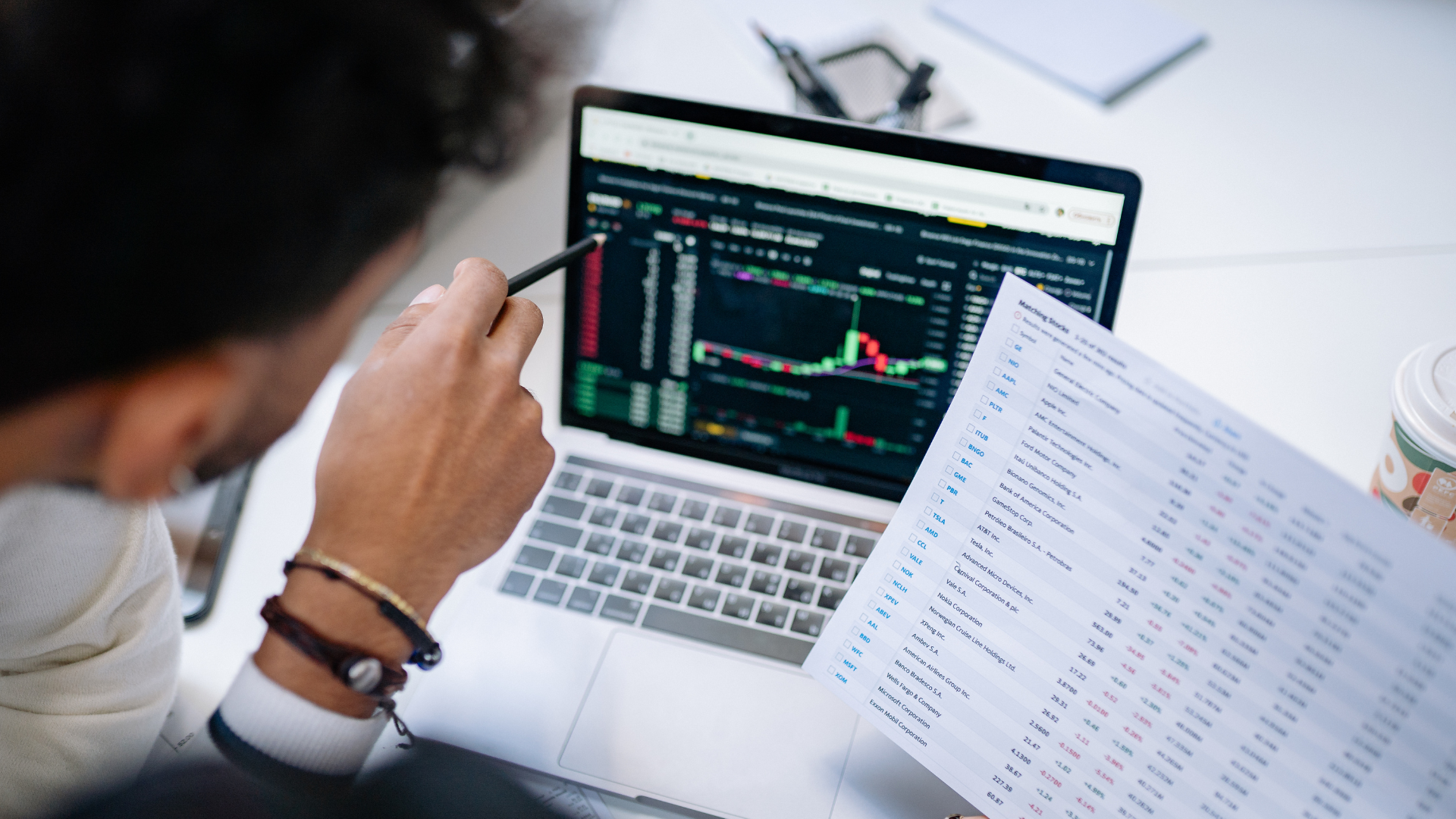 A corporate bookkeeper identifying miscategorized business expenses and transaction discrepancies on an open ledger spreadsheet.
