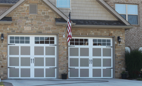 A House With Two Garage Doors And An American Flag — Somerset, KY — Somerset Burnside Garage Door & Glass Co Inc
