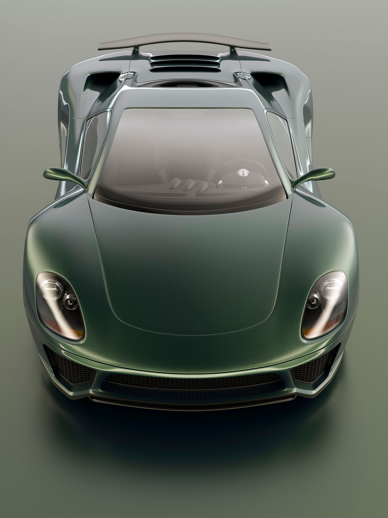 Green sports car, top-down view, sleek design, on a gray surface. Green sports car, top-down view, sleek design, on a gray surface.