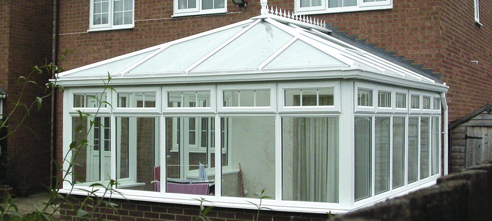 A large conservatory on the back of a house