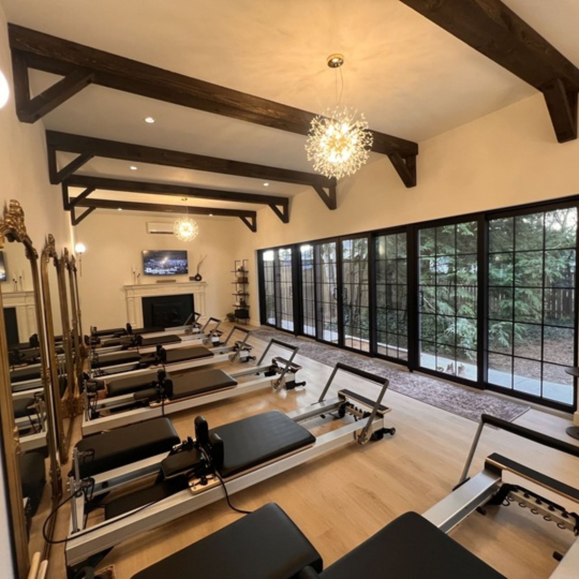 A wooden deck with stairs leading up to it and a metal railing.