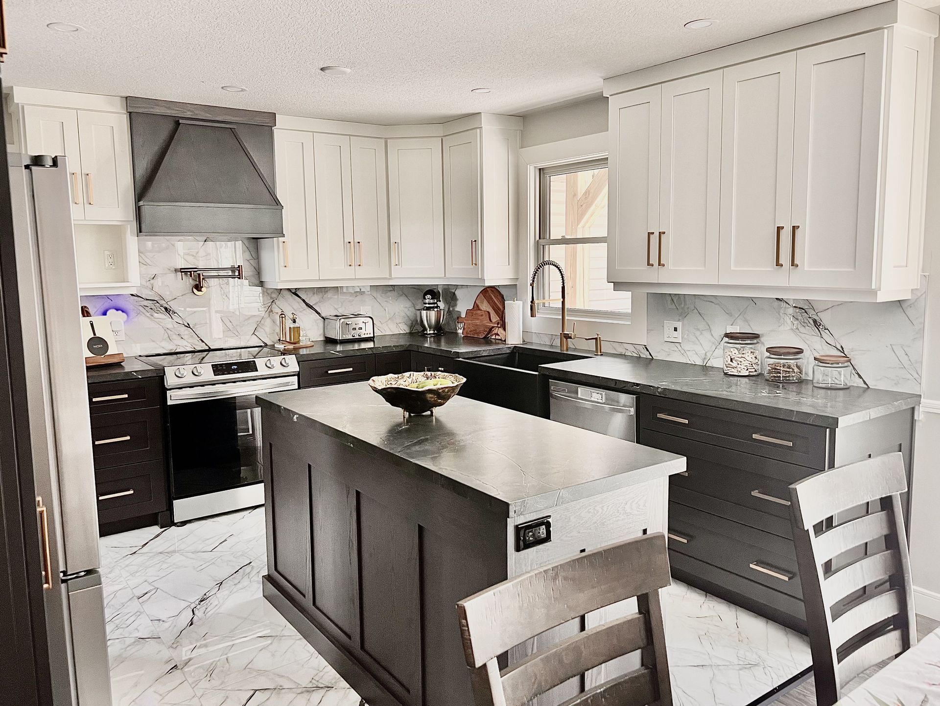 A kitchen with a large island in the middle of it.