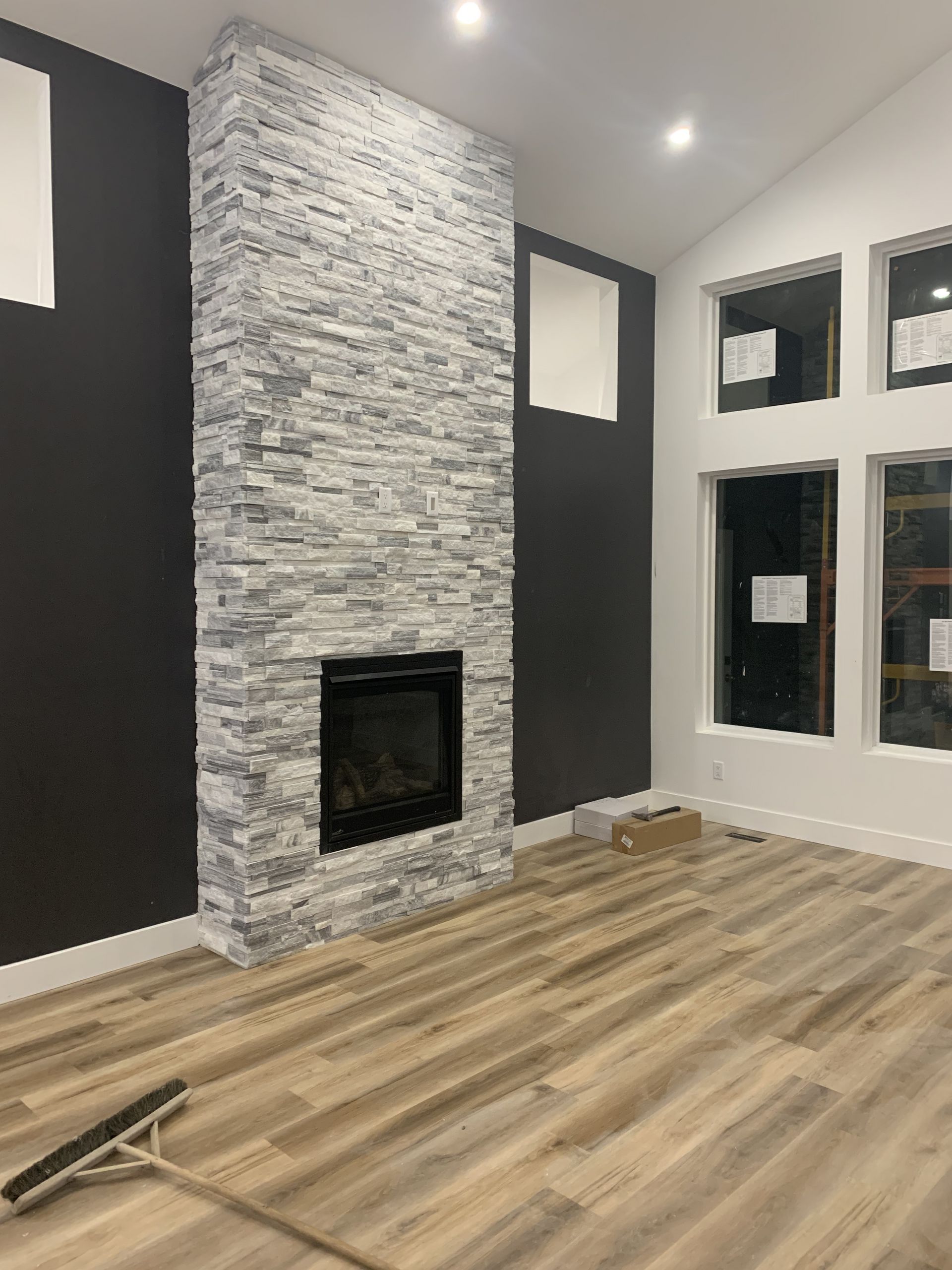 There is a fireplace in the middle of the room.