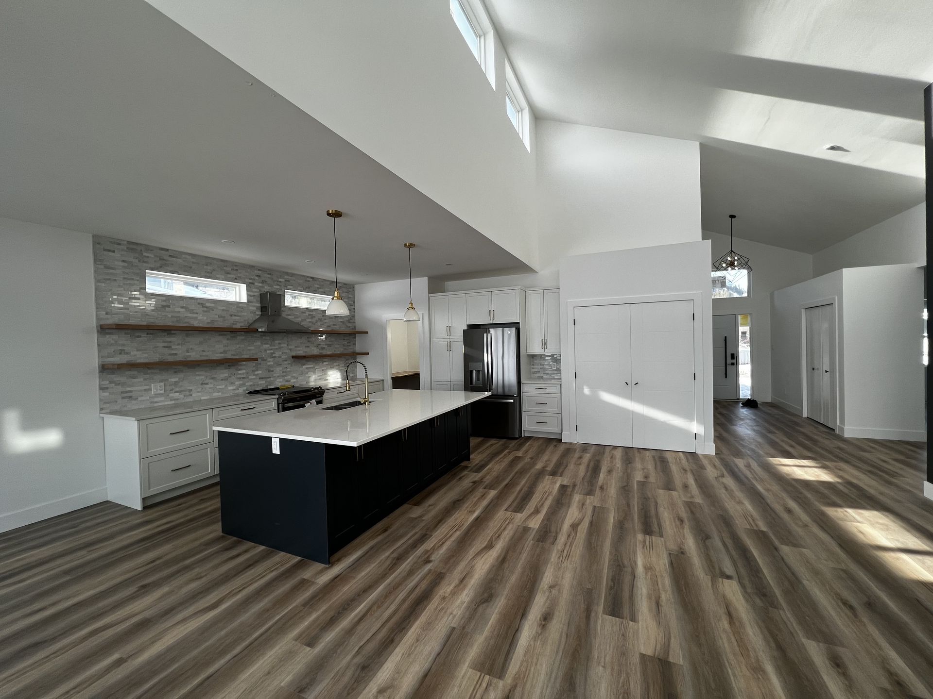 A kitchen with a large island in the middle of the room.