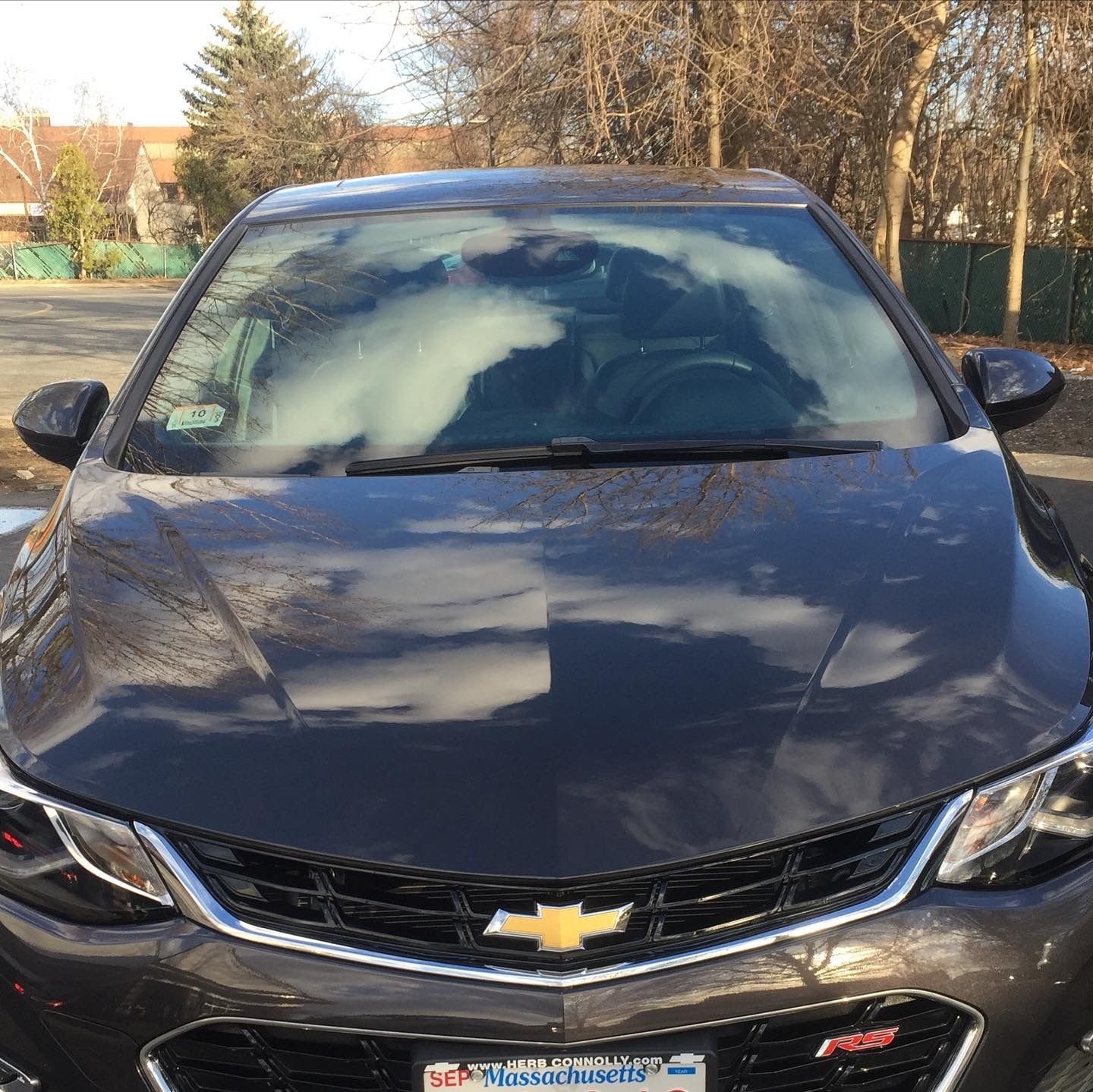 A black chevrolet cruze with a massachusetts license plate