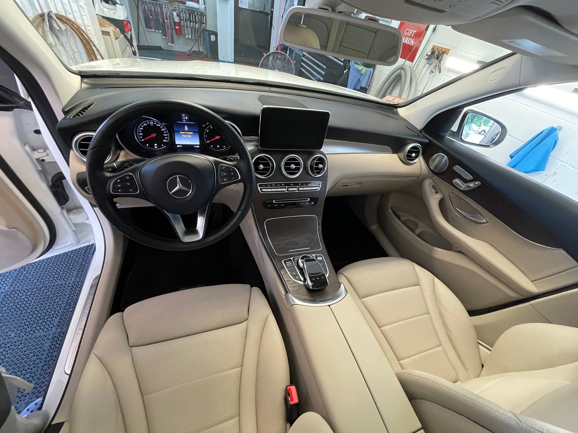 The interior of a mercedes benz with tan leather seats
