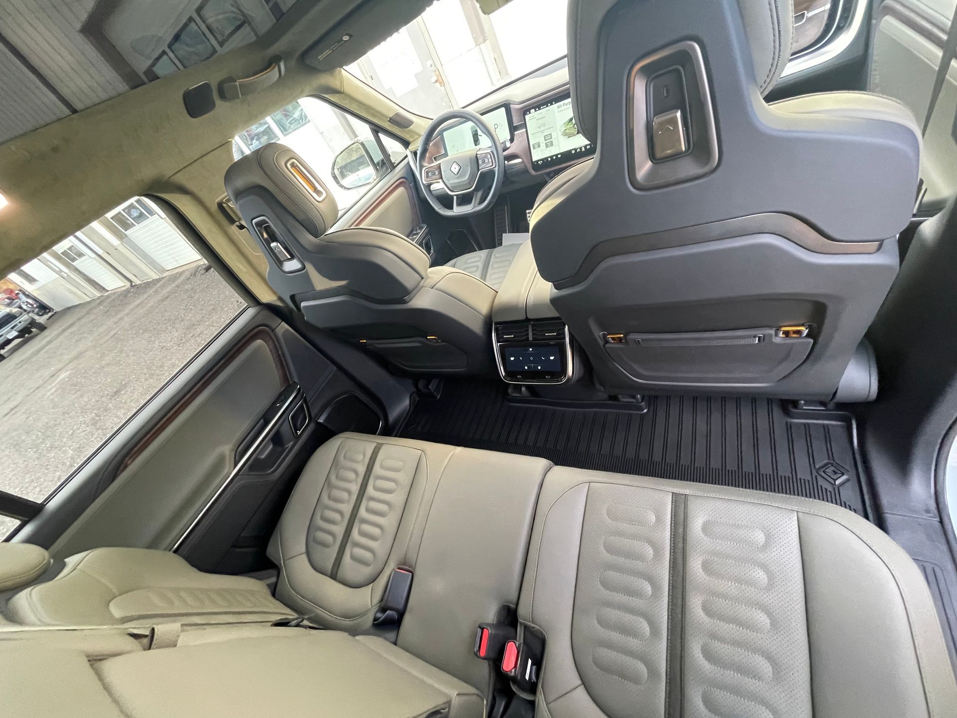 The interior of a ram truck with tan leather seats