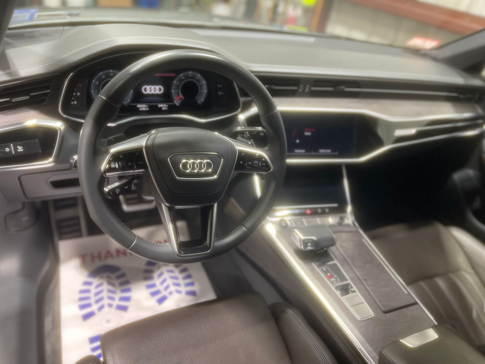The interior of an audi car with a steering wheel