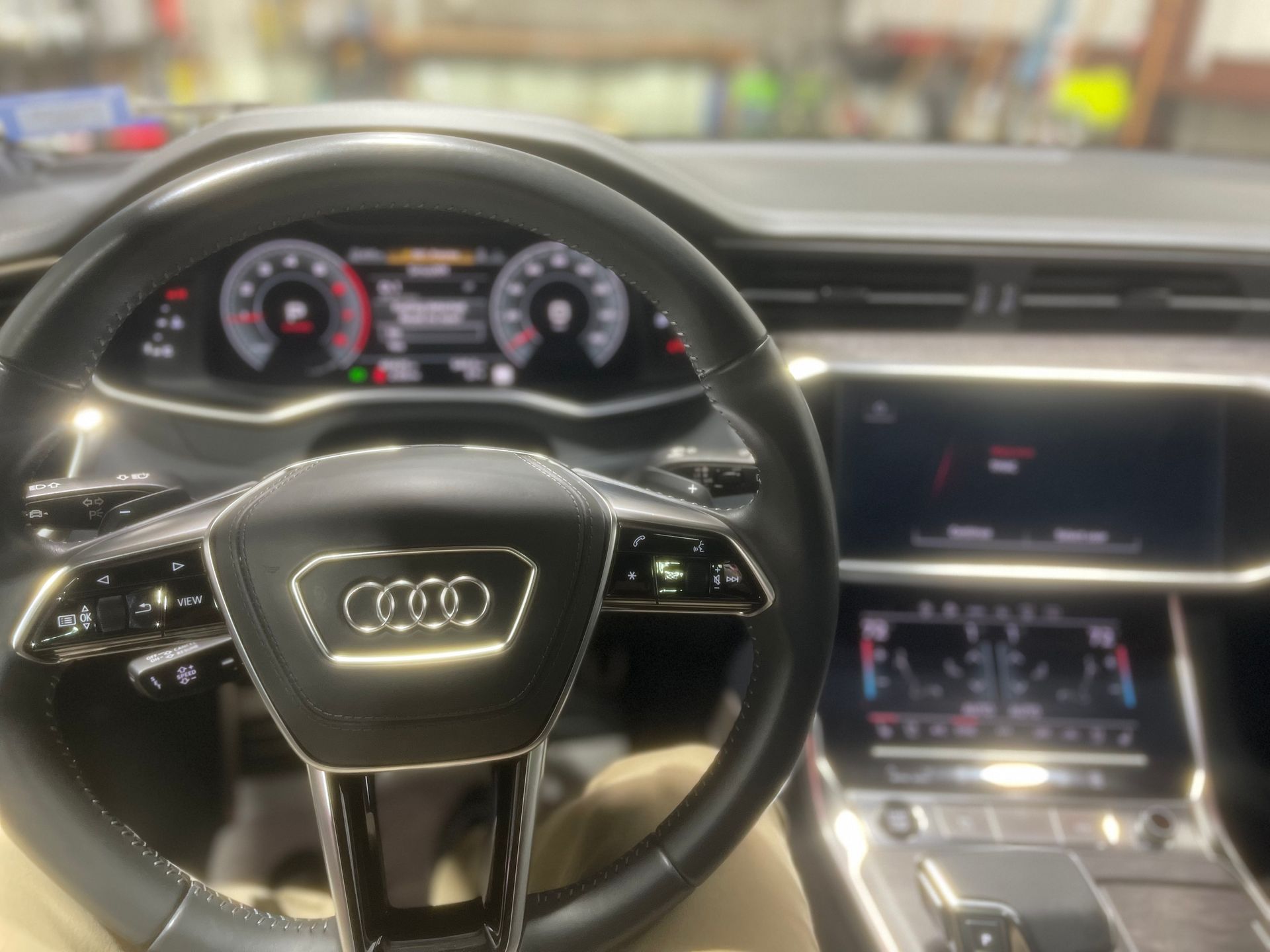 A close up of the steering wheel of an audi car