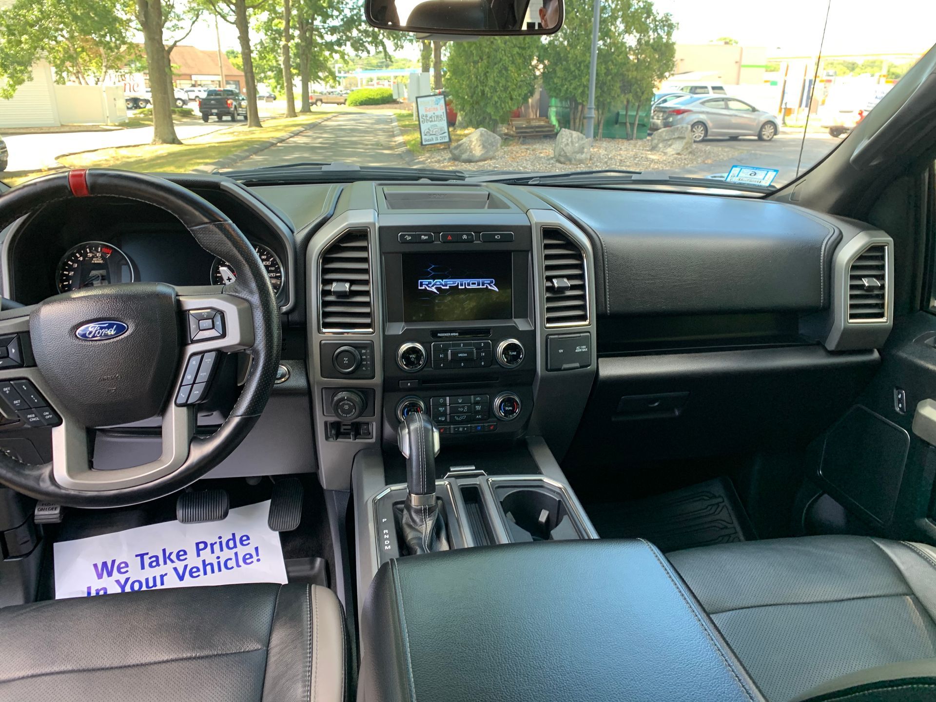 The interior of a ford f150 raptor truck is shown.