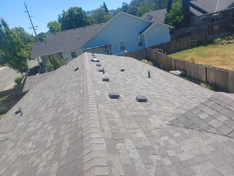 A roof of a house with a lot of shingles on it.