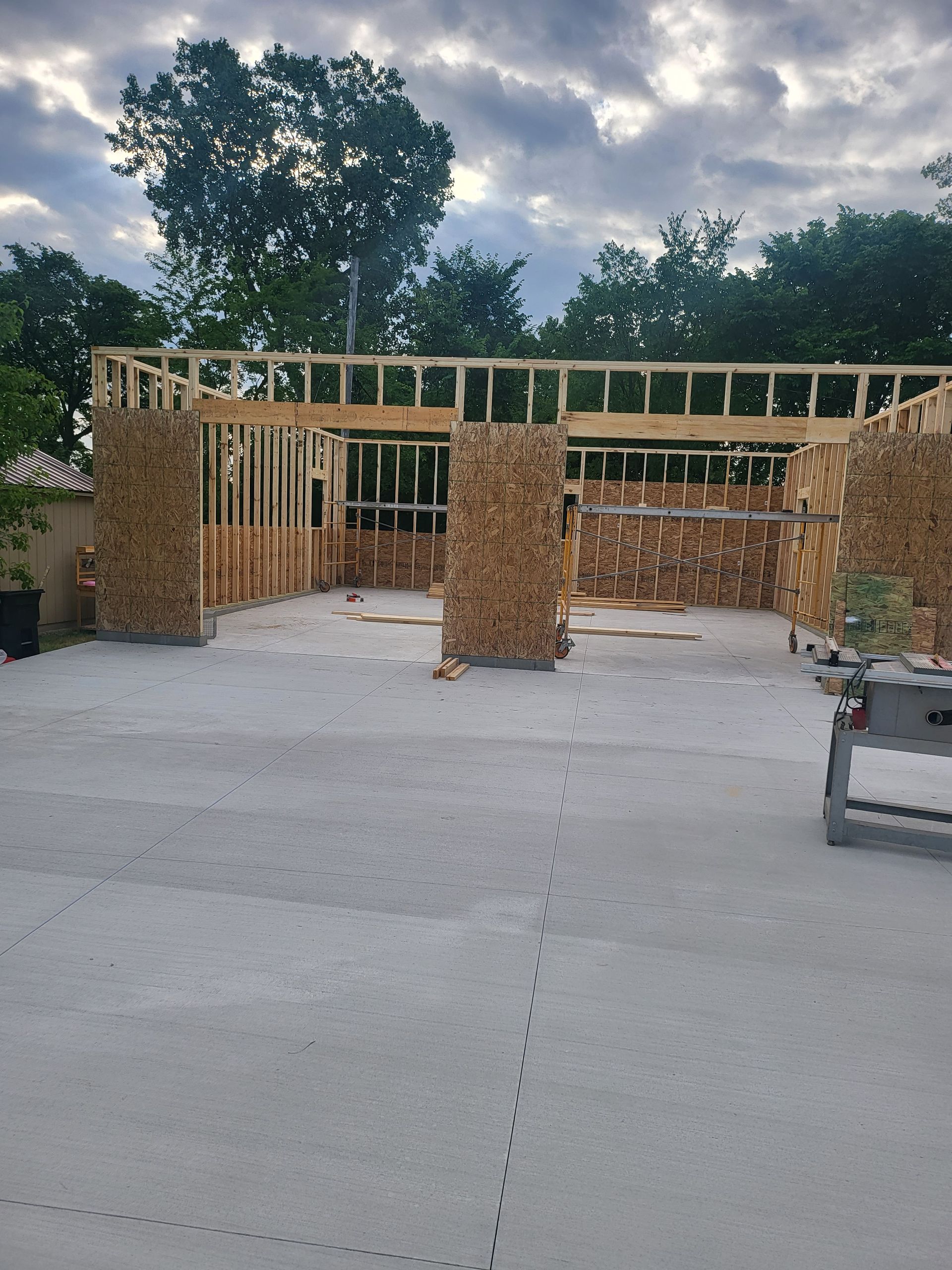 A house that is being built with a lot of wood