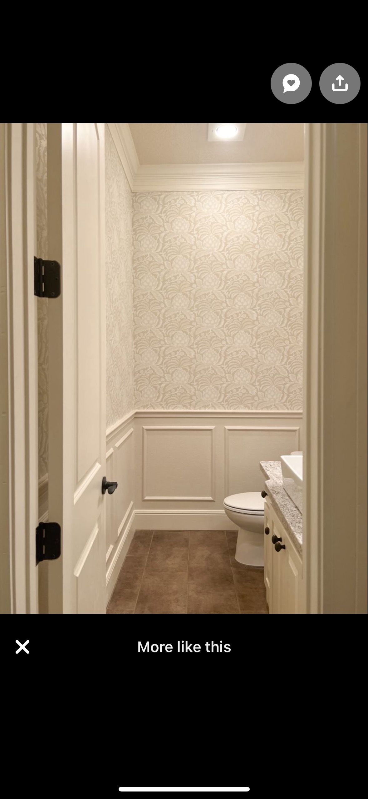 A bathroom with a toilet and a sink in it.