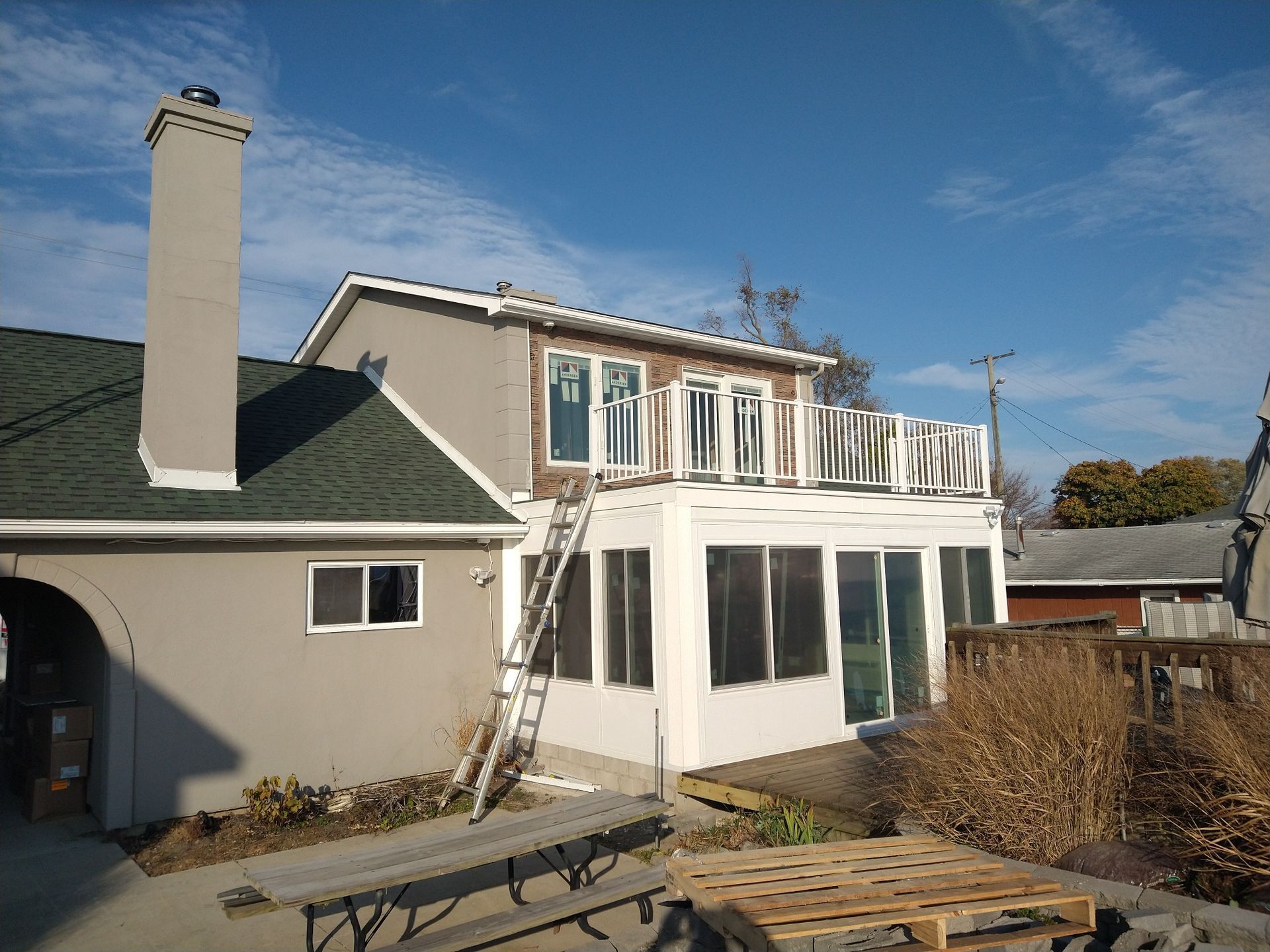 New sunroom with deck above