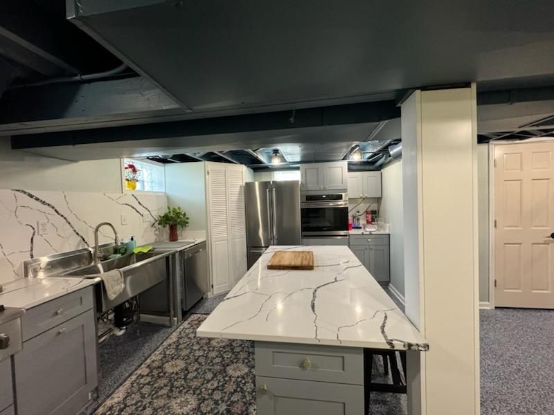 There is a large island in the middle of the kitchen.