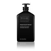 Black Revision Skincare papaya enzyme cleanser bottle with pump, white text on label.