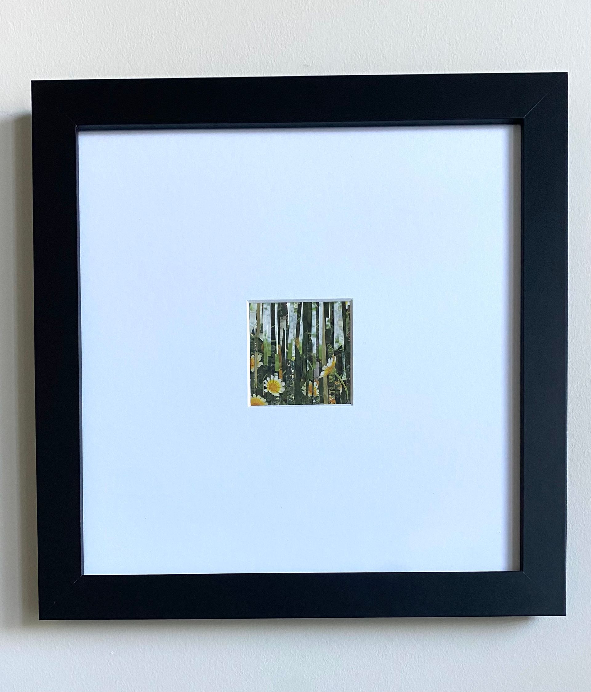 Close-up view of daisy-like flowers with yellow centers and white petals amongst green stems, created with layered strips.