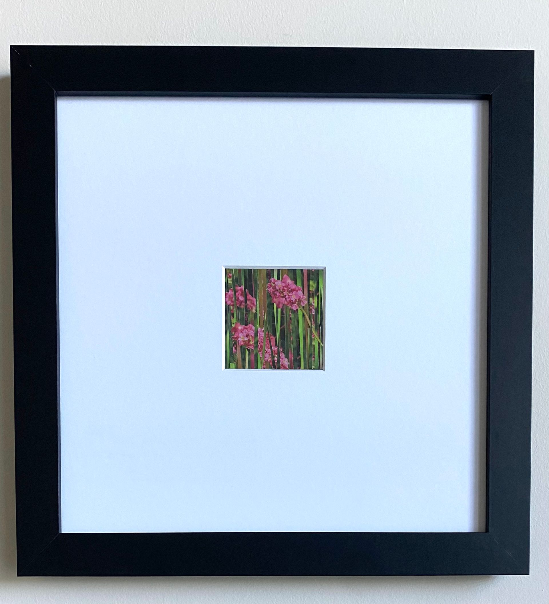 Pink flowers peek through vertical green stripes.