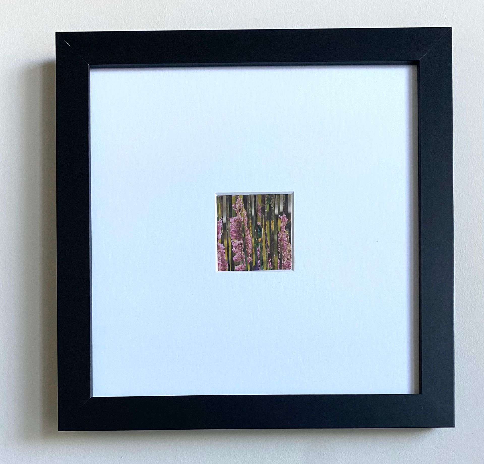 Pink wildflowers through vertical strips, creating a layered, textured view.