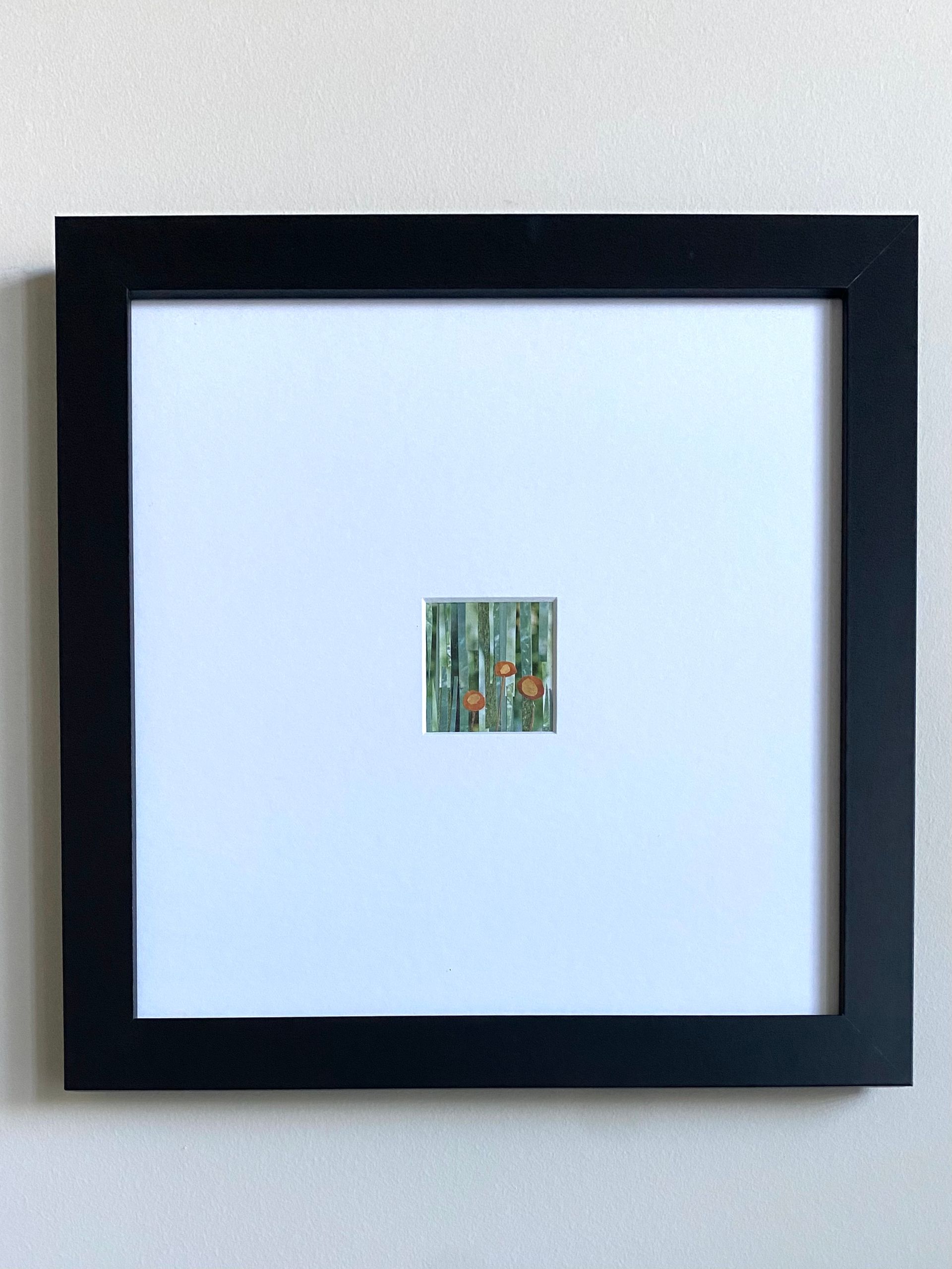 Orange flowers with brown stems against a striped green background.