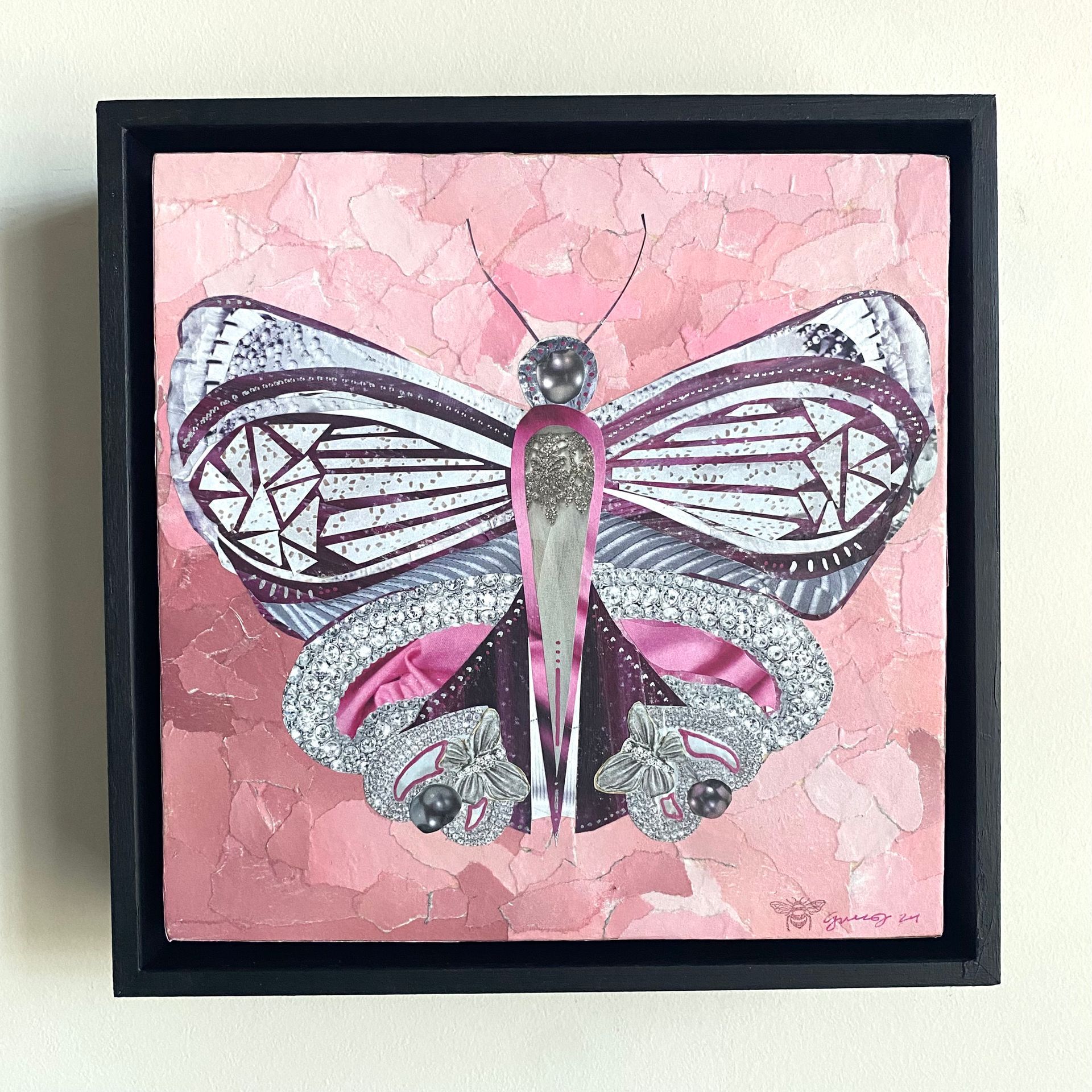 Pink butterfly collage with silver and purple accents, on a pink background.