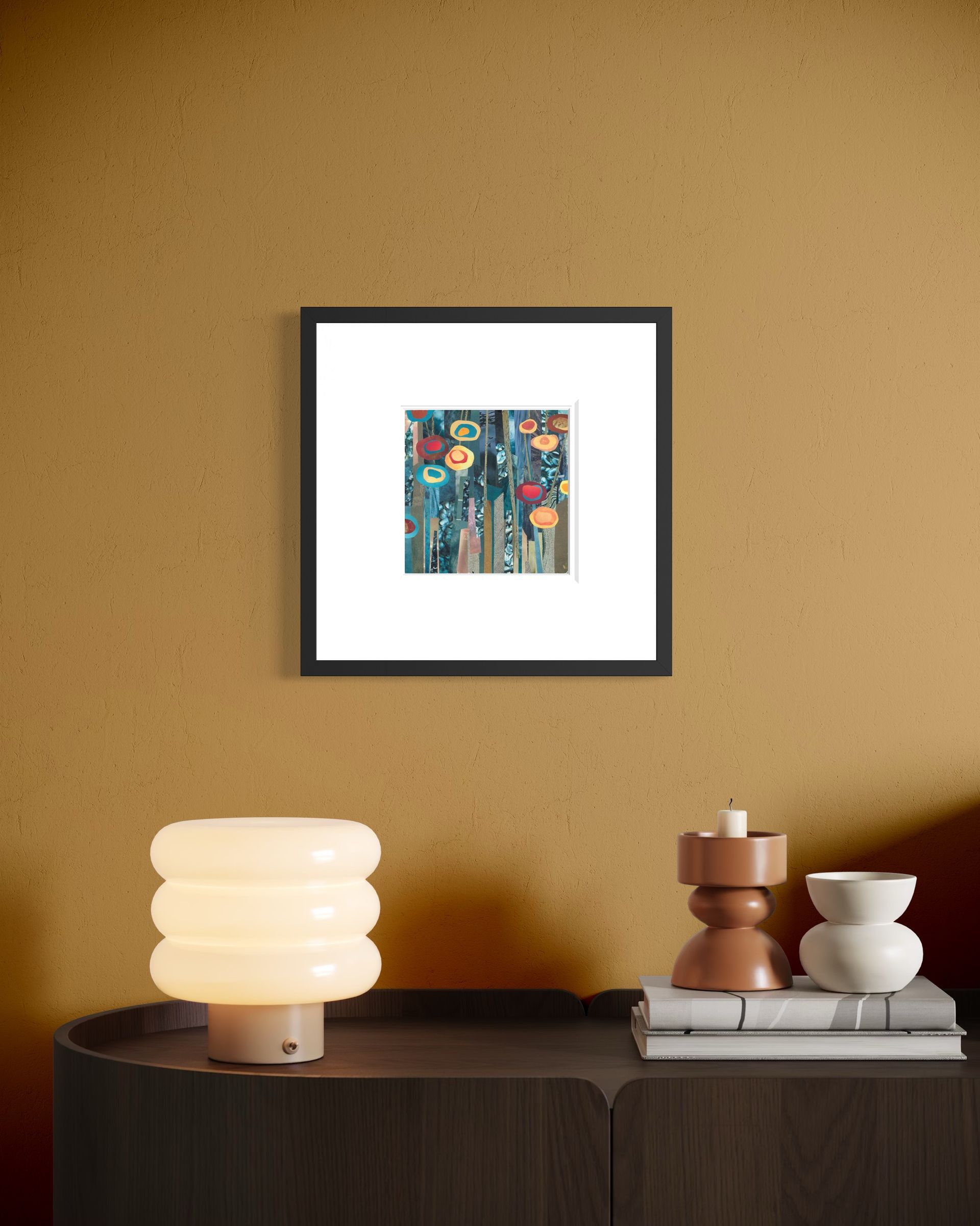 Collage of colorful, abstract flower shapes in shades of blue, gold, and red against a background of vertical paper strips.