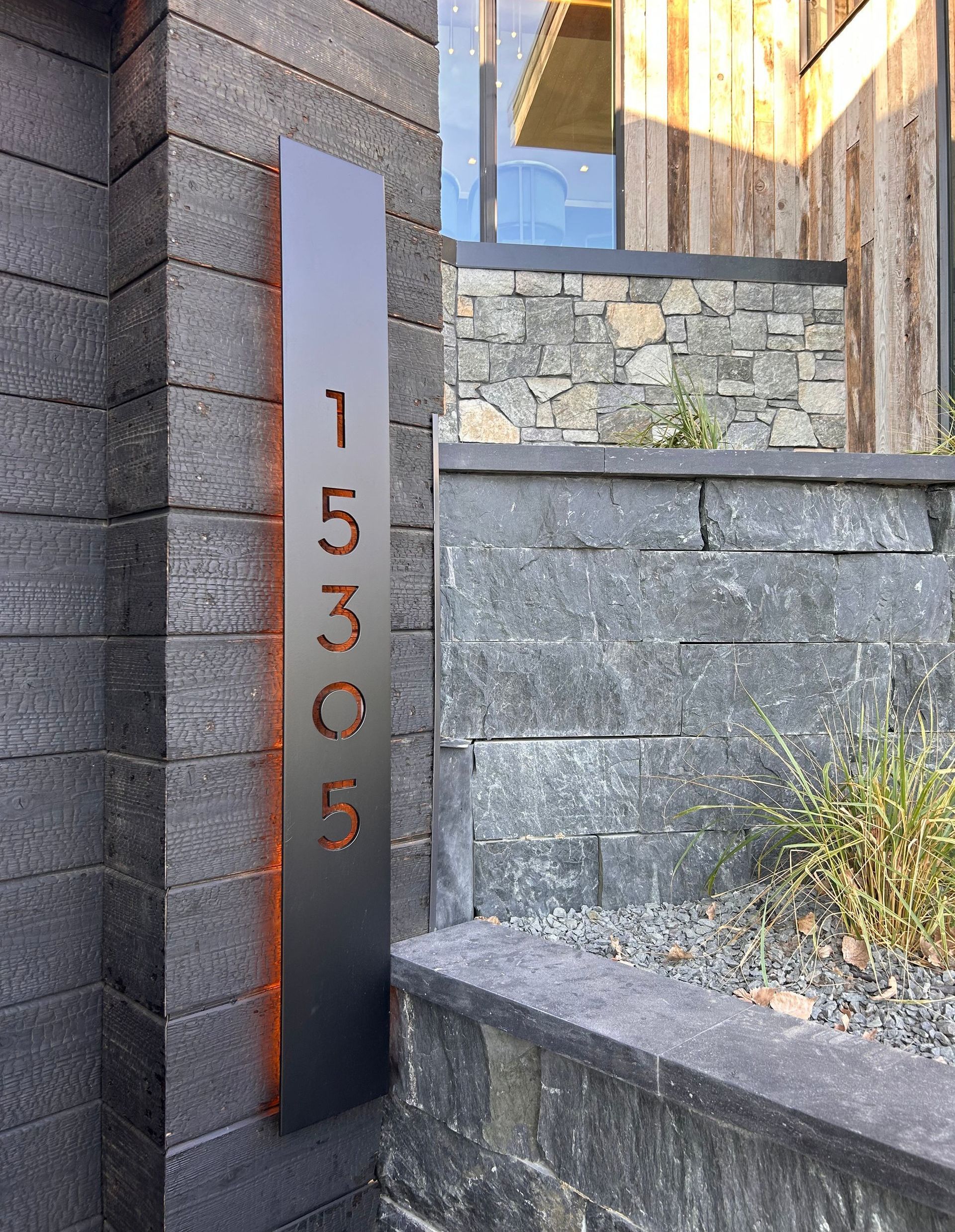 A brick wall with a sign that says 1555 on it.