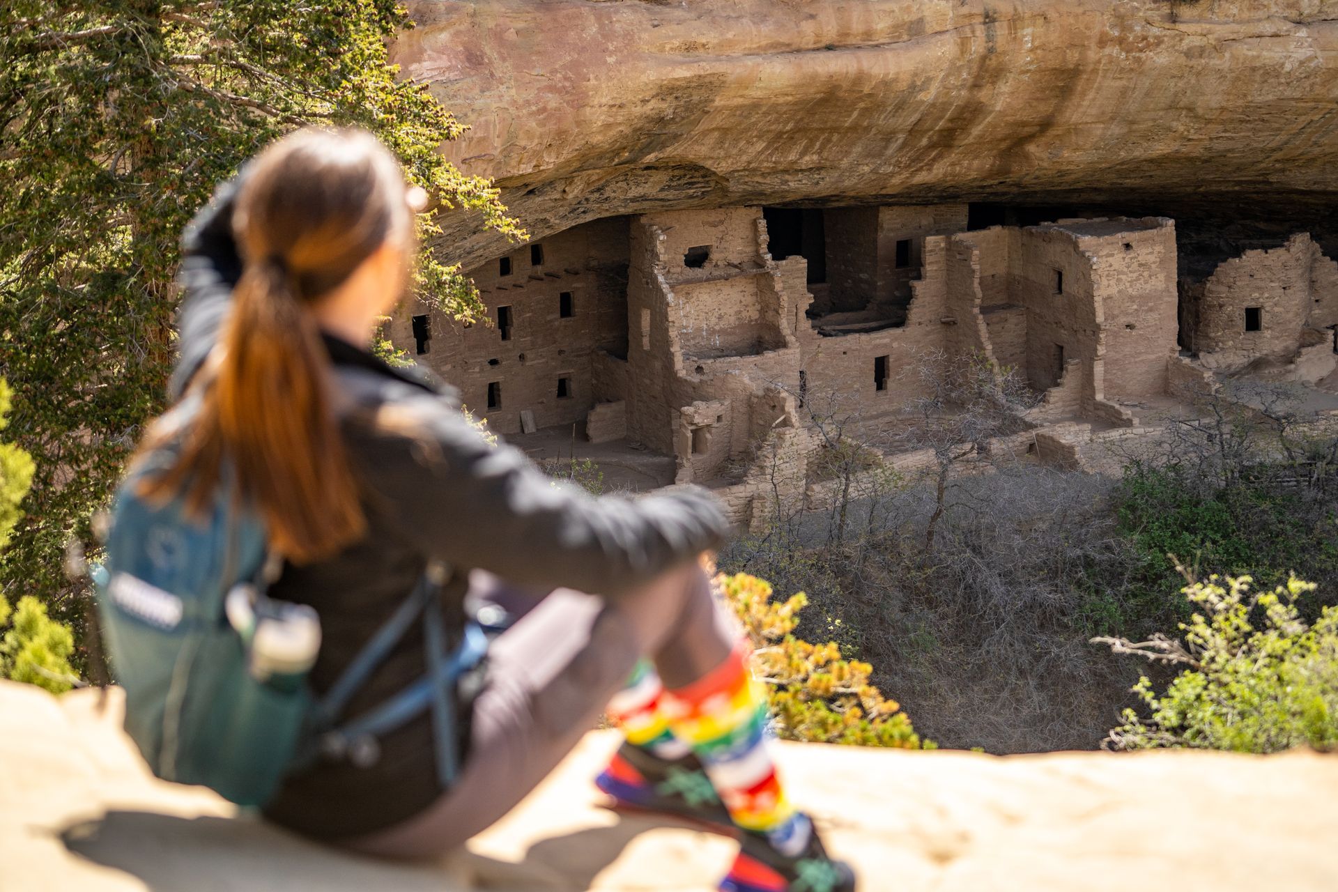 woman overlooks Mesa Verde