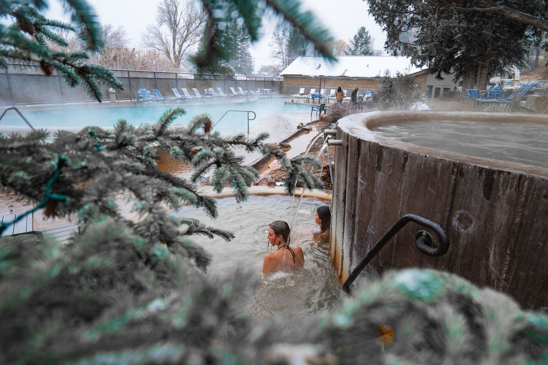 A group of people are taking a bath in a hot tub.