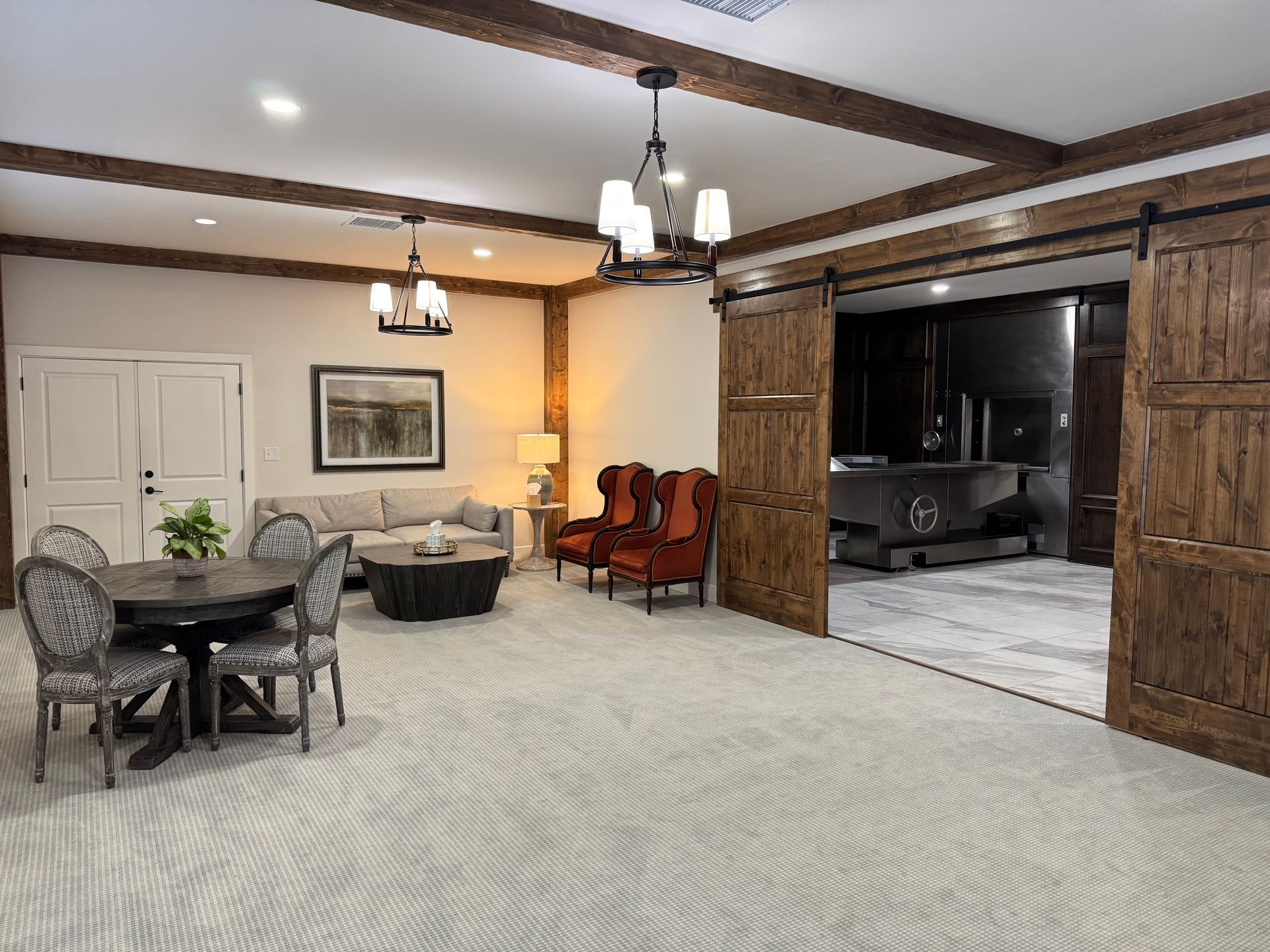 Rivercrest is a large white building with the letter r on the front