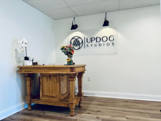 A wooden reception desk stands below an 