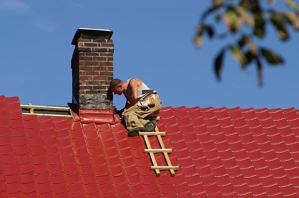 Installing roof around the chimney — Gainesville, FL — Whittle’s Roofing Co. Inc