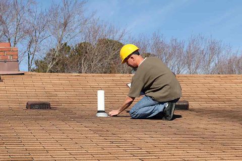Man doing a roof inspection — Gainesville, FL — Whittle’s Roofing Co. Inc Man doing a roof inspection — Gainesville, FL — Whittle’s Roofing Co. Inc